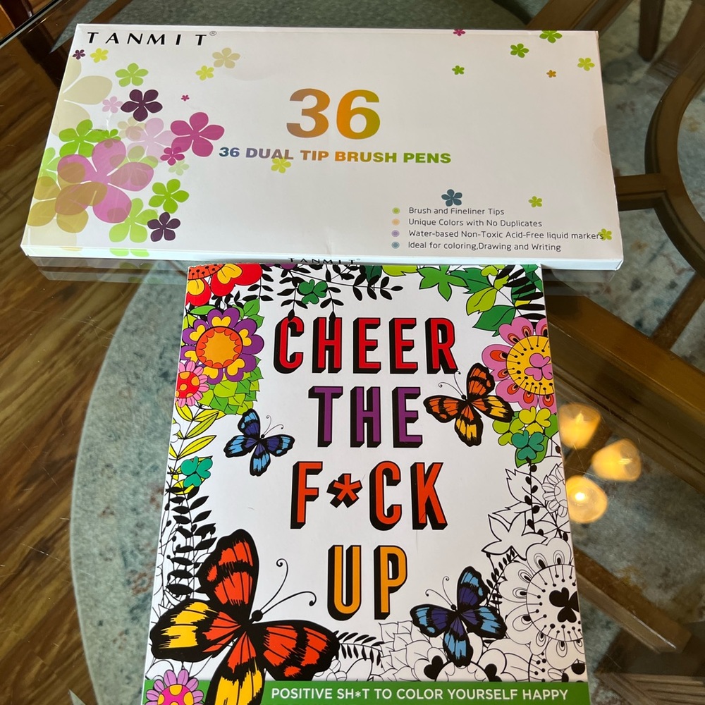 Brand new set of markers and adult color book
